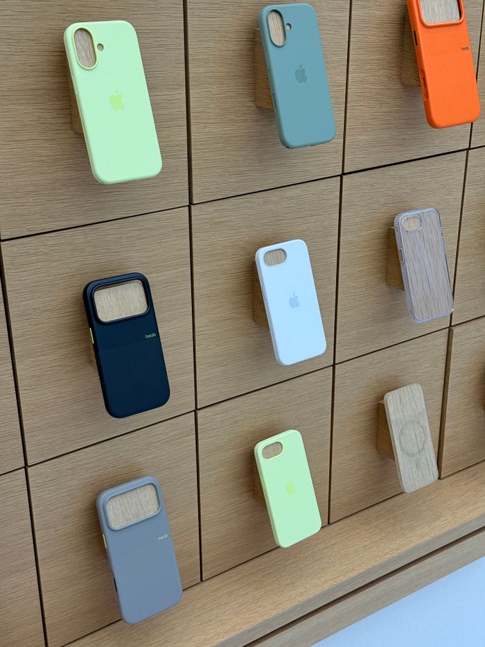 Crafting Captivating Headlines: Your awesome post title goes here A variety of colorful phone cases displayed on a sleek wooden wall in a store.
